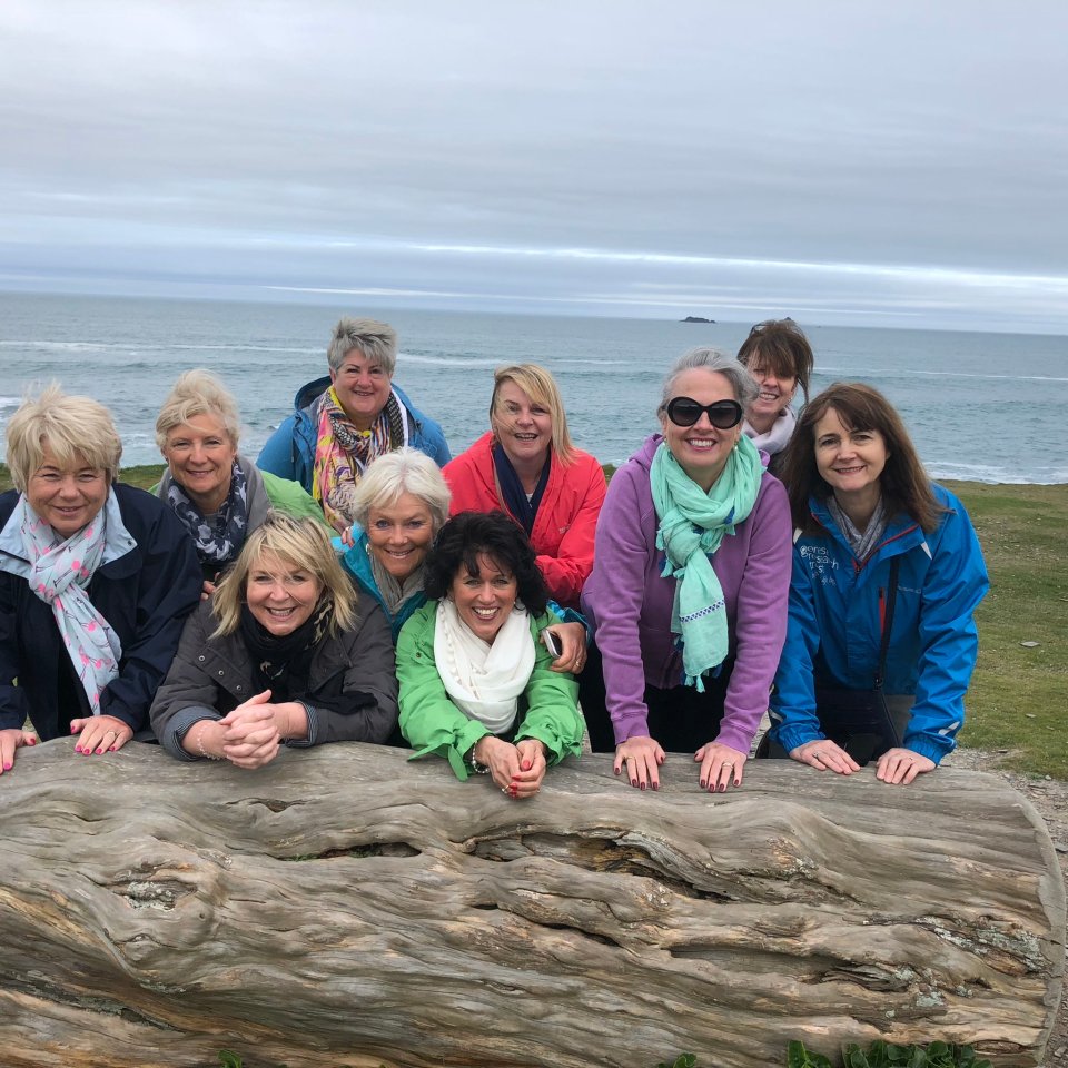 Fern and Lorraine, pictured bottom centre, on a beach walk with pals