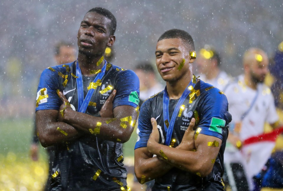 Pogba alongside team-mate Kylian Mbappe