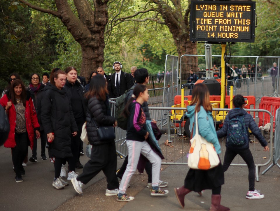 Sign warns of at least a 14-hour wait to get inside