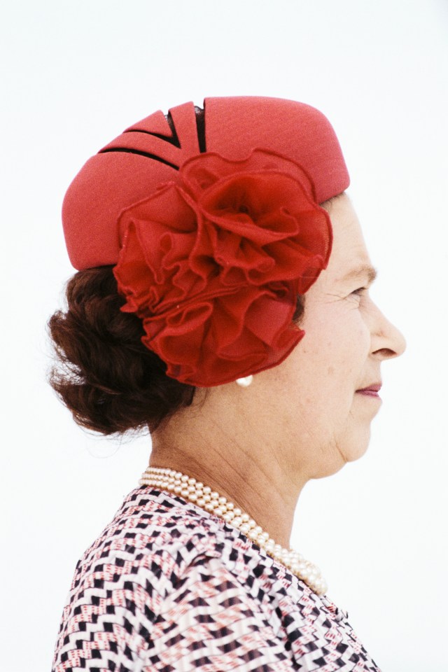 The Queen wore this gracious red hat in Pune, India, in 1983