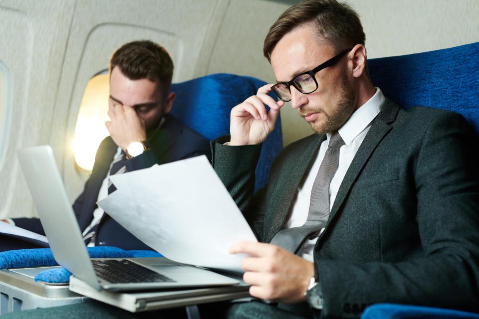 A passenger who wanted to work on a long flight slammed a man who reclined two seats on the plane (stock image)