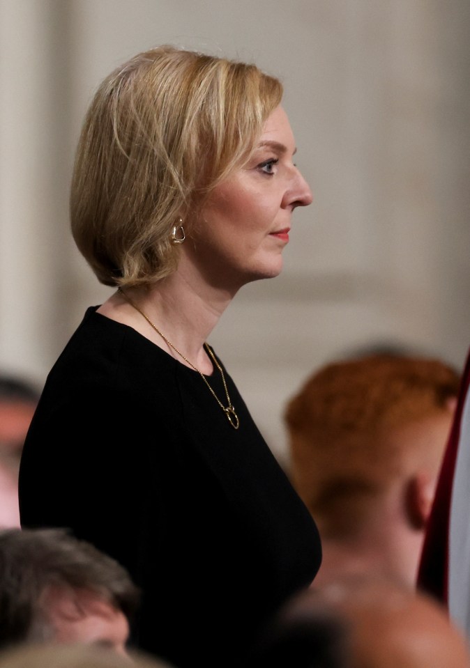 Prime Minister Liz Truss looked deep in reflection as she joined the congregation on Friday