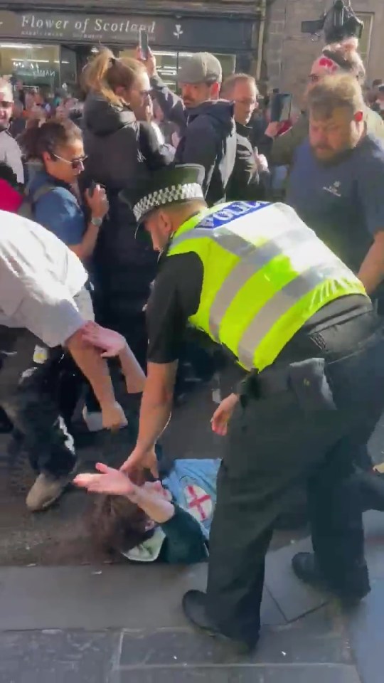 A policeman then went to help him up