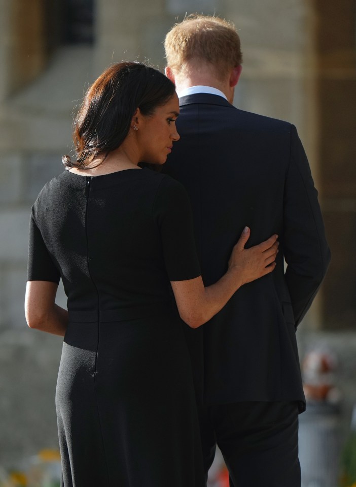 The Duchess of Sussex comforted her husband in emotional scenes following the passing of the Queen