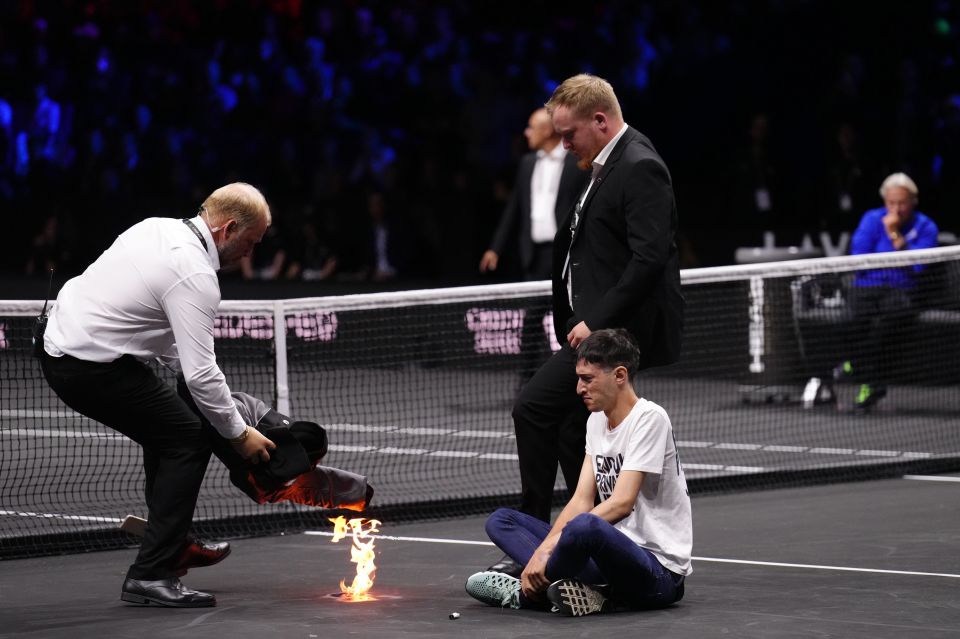 Staff quickly rushed to extinguish the flames on the court