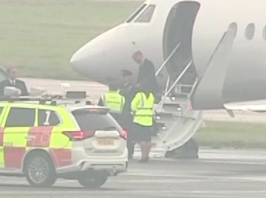 Prince William is seen disembarking the plane