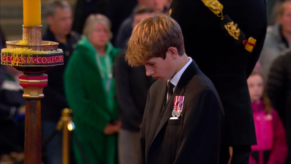 James, Viscount Severn bows his head before the Queen's coffin