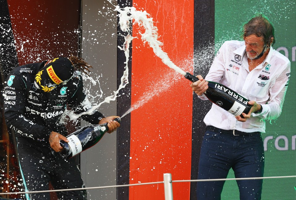 Hamilton and Ratcliffe celebrate on the podium following a race around Spain last year