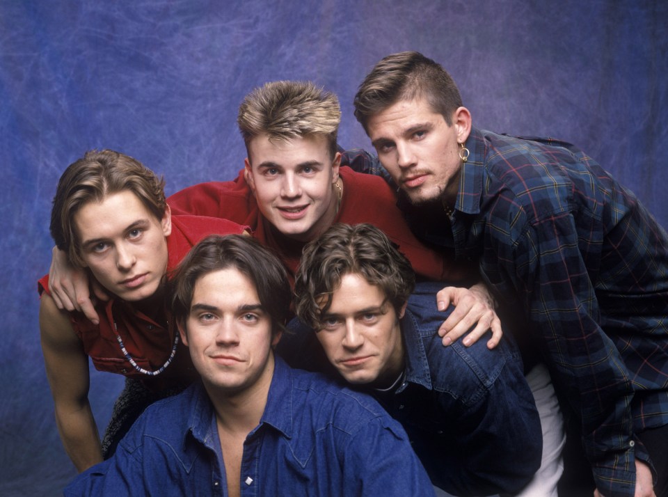 Mark, far left, looked completely different from his Take That heyday