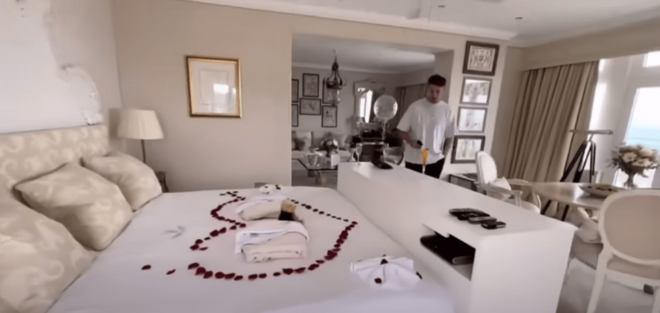 The happy couple were treated to a huge bed with rose petals