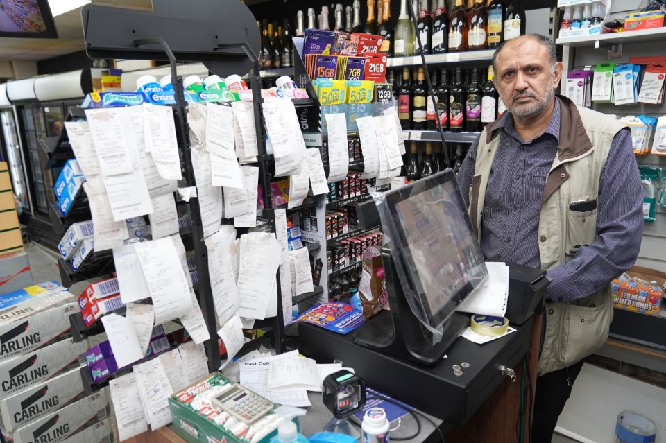 Abid Hussain owns a North Yorkshire store and has a wall of unpaid receipts