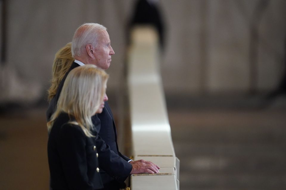 Biden and his wife Jill view the coffin of the Queen