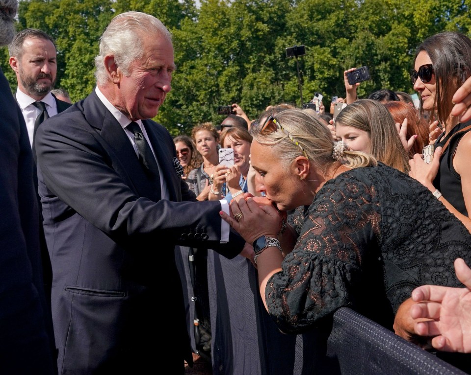 Another royal fan planted a peck on the King’s hand in a touching gesture