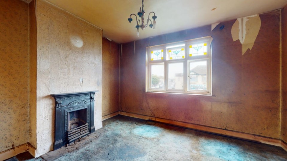 The living room features a fireplace, chandelier and stain glass windows