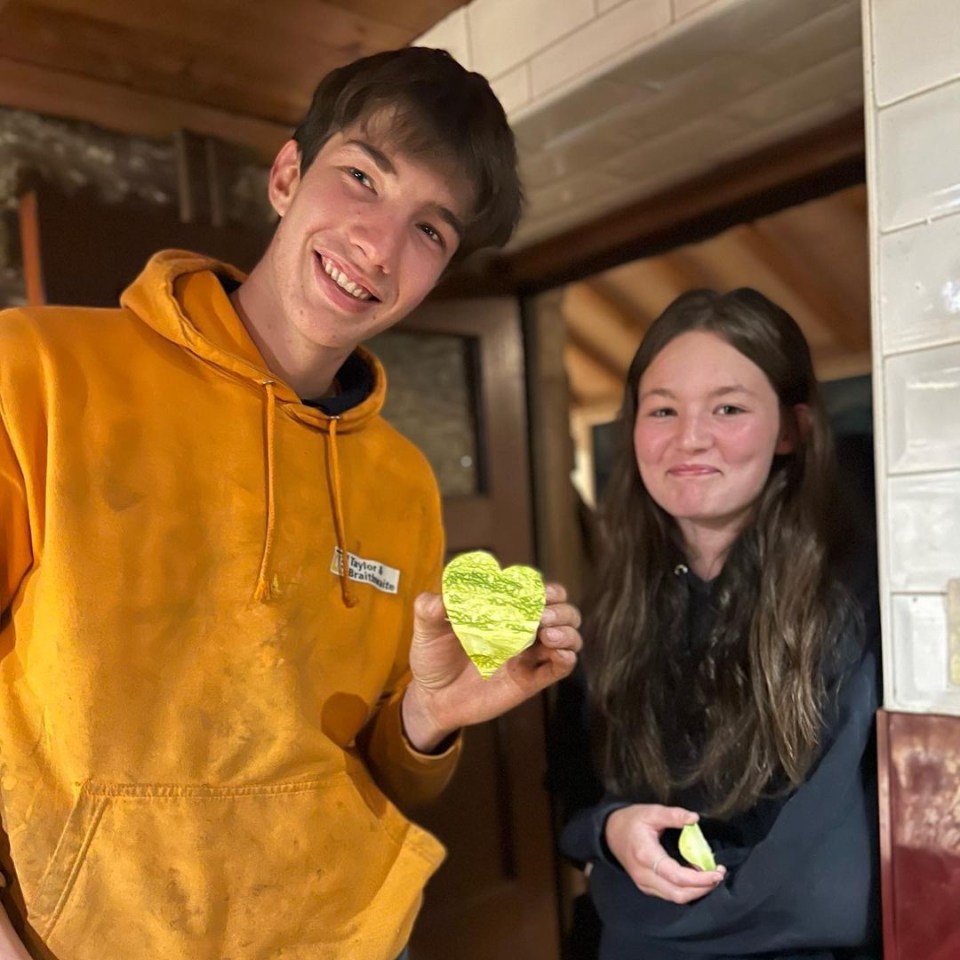 Reuben posed with his carving alongside girlfriend Sarah Dow