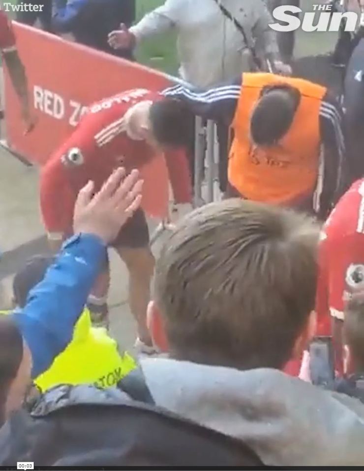 Ronaldo appearing to knock a fan’s mobile phone to the ground