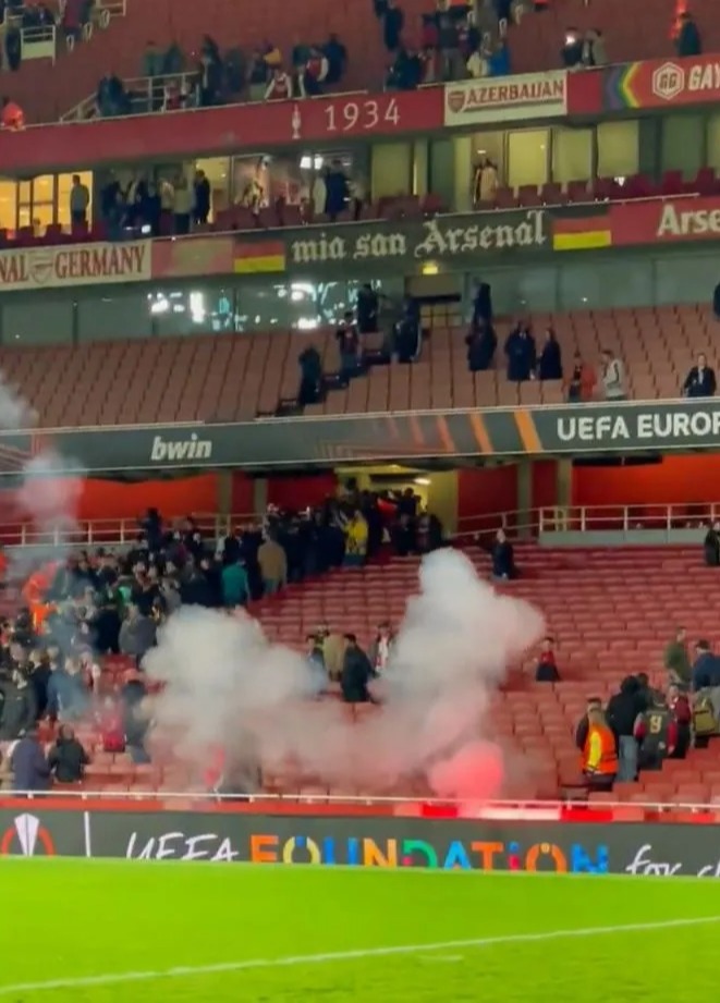 A puff of smoke engulfed the Arsenal end behind one of the goals