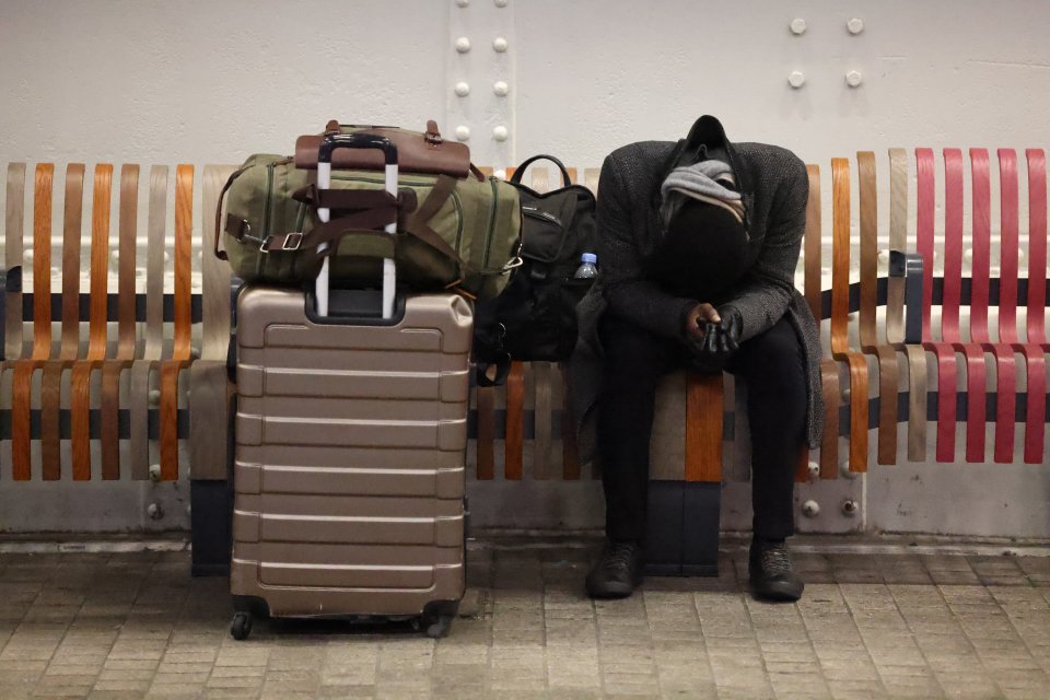 A train passenger attempting to sleep at London's Paddington Station