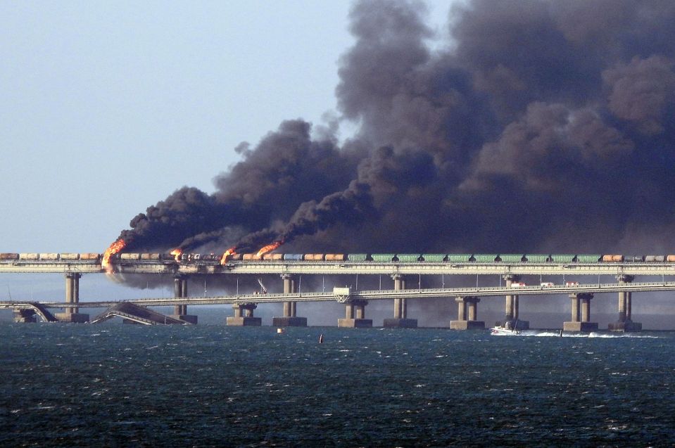 Black smoke billows from a fire on the Kerch Bridge that links Crimea to Russia