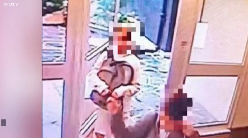 Chilling CCTV showed the alleged moment the woman and her victim were standing next to a block of flats