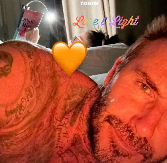 David Beckham shared a rare topless selfie in bed with wife Victoria