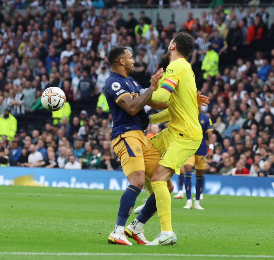 Hugo Lloris bundled into Callum Wilson who opened the scoring