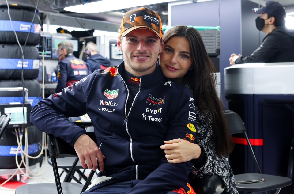 Verstappen and girlfriend Kelly Piquet pose for a photo after his win