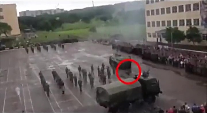 Footage shows the moment he was run over by the tank before hobbling back to his feet