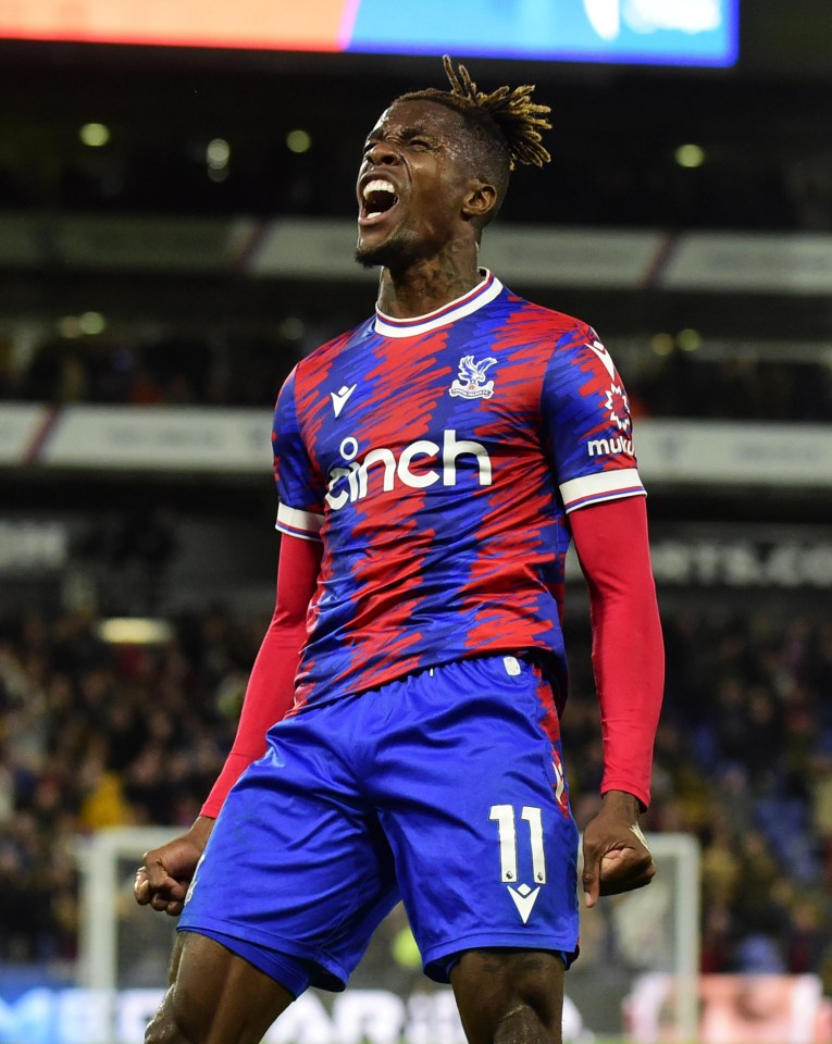 Wilfried Zaha celebrates after securing the points against Wolves