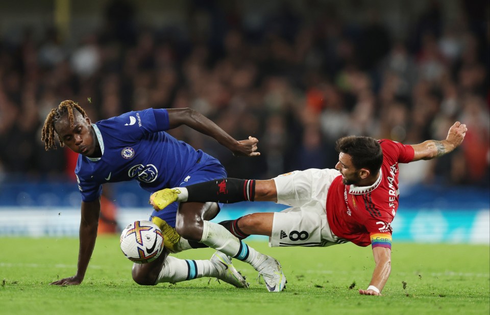 Trevor Chalobah and Bruno Fernandes go for the ball