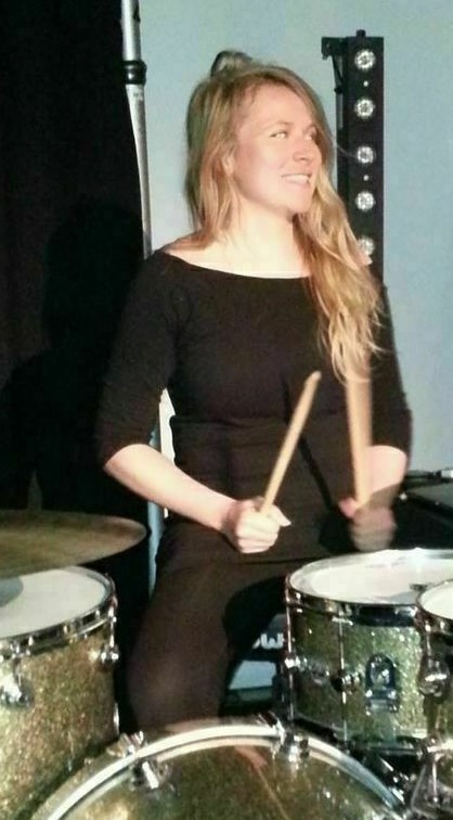 Jemma Mitchell is seen playing the drums in her church