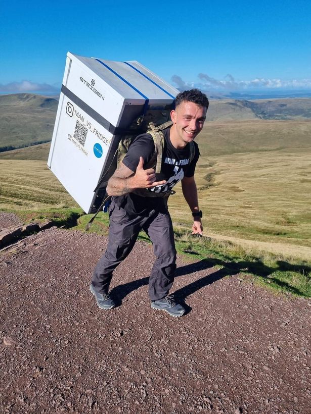 Cpl Sam Hammond climbed the three highest mountains in Wales in one day with a fridge on his back