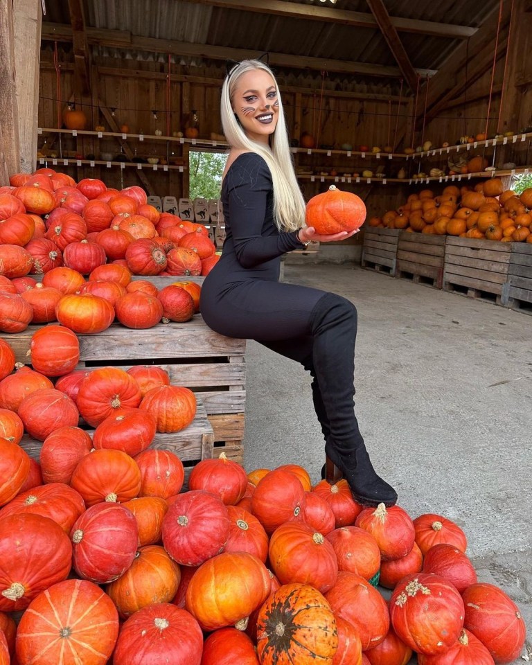 The striker posed with pumpkins as she got into the spooky spirit