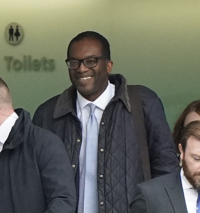 Kwasi Kwarteng arrives at Heathrow Airport after cutting short a trip to the US