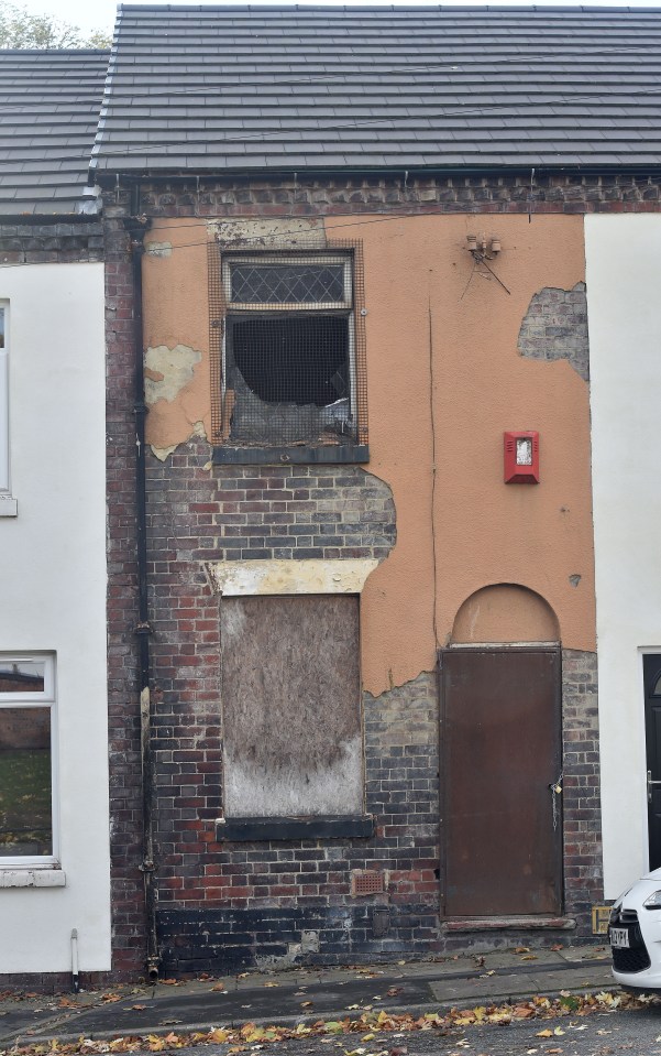 The street was run down and derelict, with some houses still a state