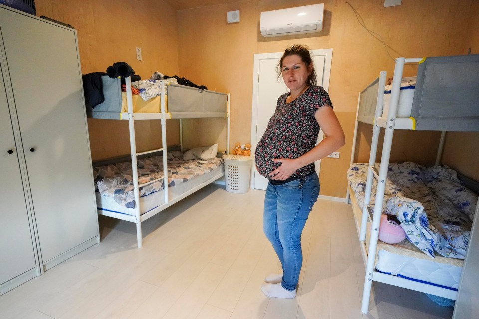 Mum-of-two Olha Kravchenko, 32, from the Kharkiv district - who is expecting a baby this month