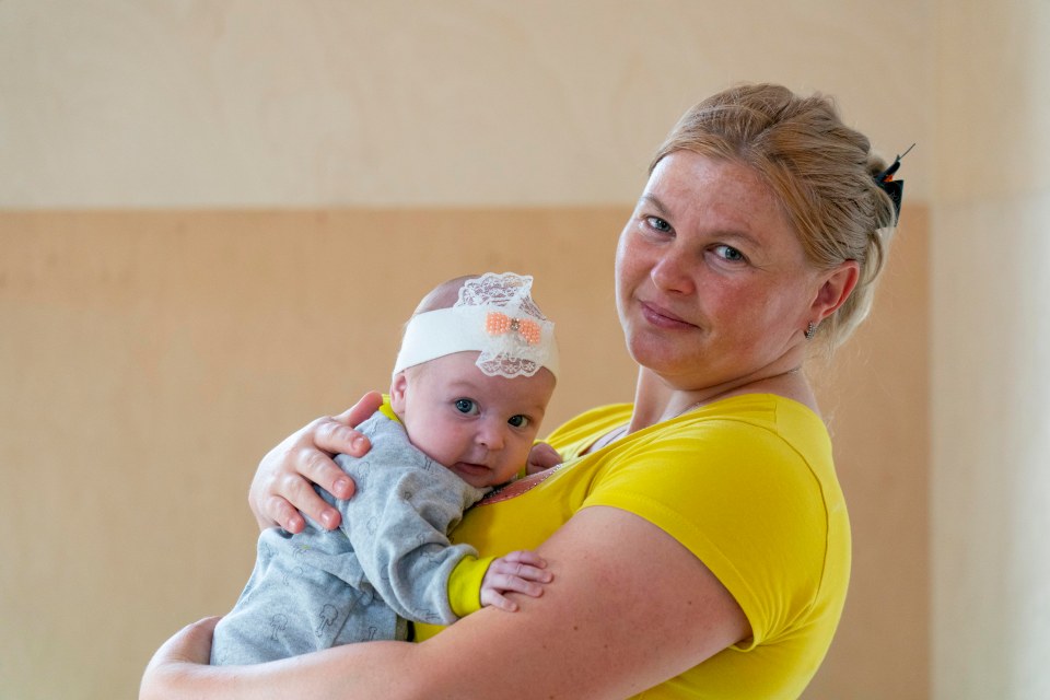 Mum-of-four Olha Schevechenko, 32, from Lysychansk with two-month-old Daruna