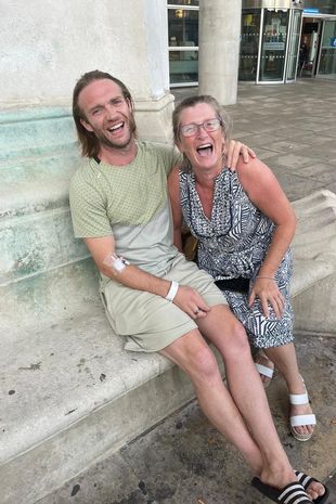 Chris with his mum before being released from hospital