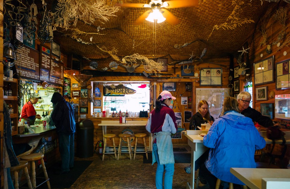 Visitors dining inside Whittier’s Swiftwater Seafood Cafe