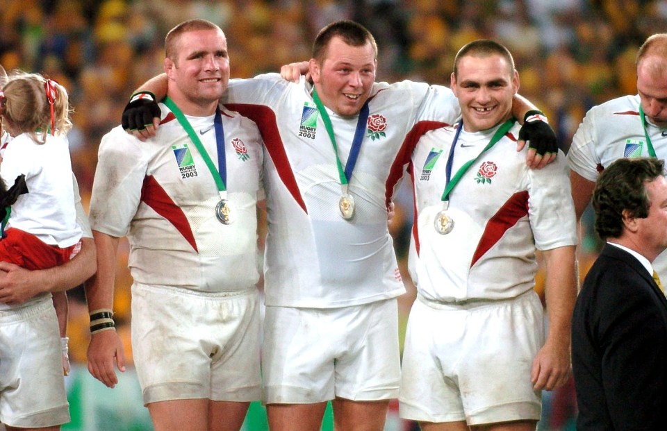 The all-conquering trio of Phil Vickery, Steve Thompson and Trevor Woodman after England's Rugby World Cup final victory