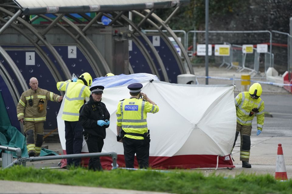 Cops covered a car - believed to be involved in the incident - in forensic tent