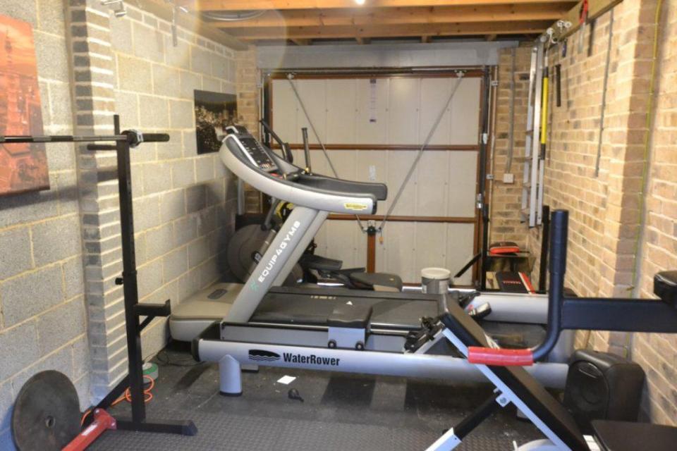 Carl's garage is filled with gym equipment