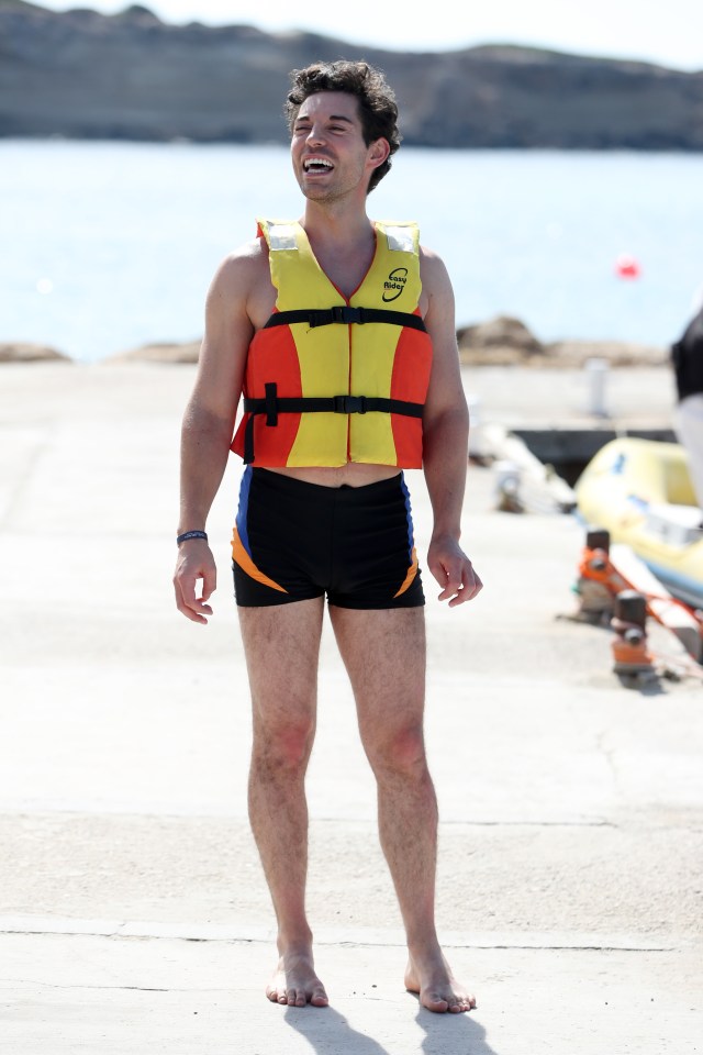 Tom wore a life vest as he took to the water