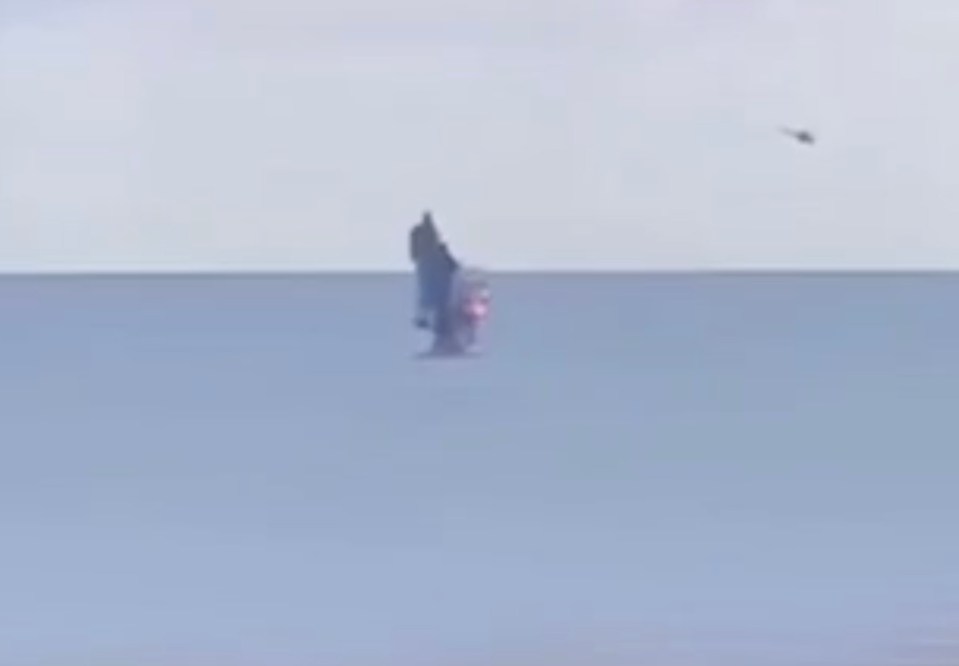 A Russian helicopter destroying a Ukrainian submersible drone