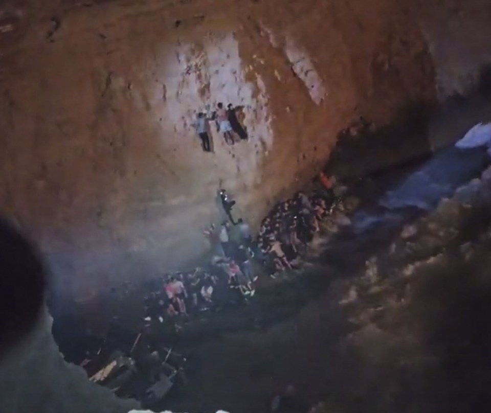 Desperate shipwreck survivors scramble up steep cliffs at the island of Kythira