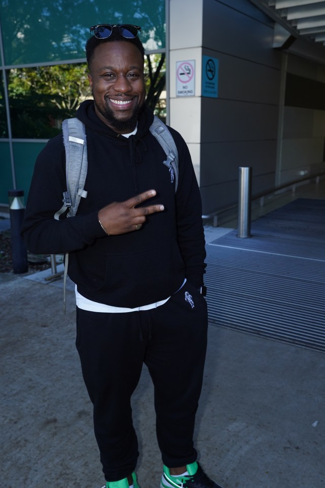 He posed with a big smile outside the airport