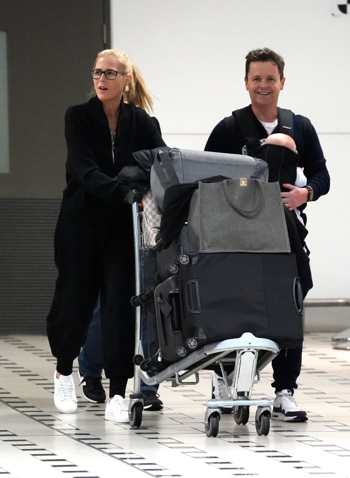 Dec was seen landing with his wife and kids