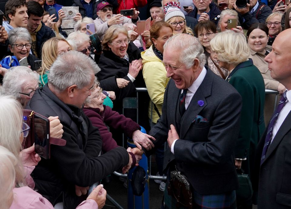 Charles and Camilla pictured on a walkabout in Dunfermline, as they conferred its new city status