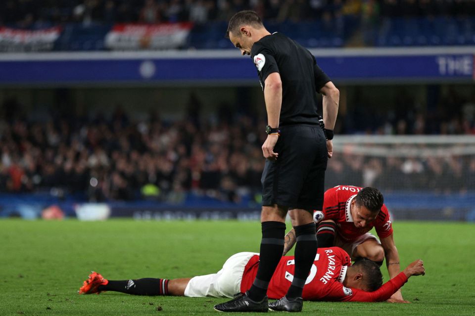 Varane went down after trying to tackle Pierre-Emerick Aubameyang