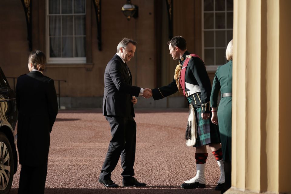 Liz Truss' husband Hugh O'Leary is greeted at Buckingham Palace